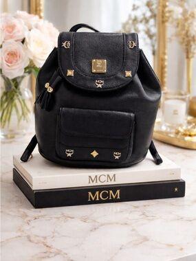 MCM Black Leather Drawstring Backpack with Gold Accents